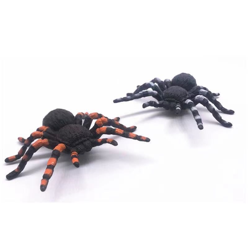 Set of four realistic, soft rubber spider mom and spiderlings toys for kids, ideal for outdoor Halloween-themed play.