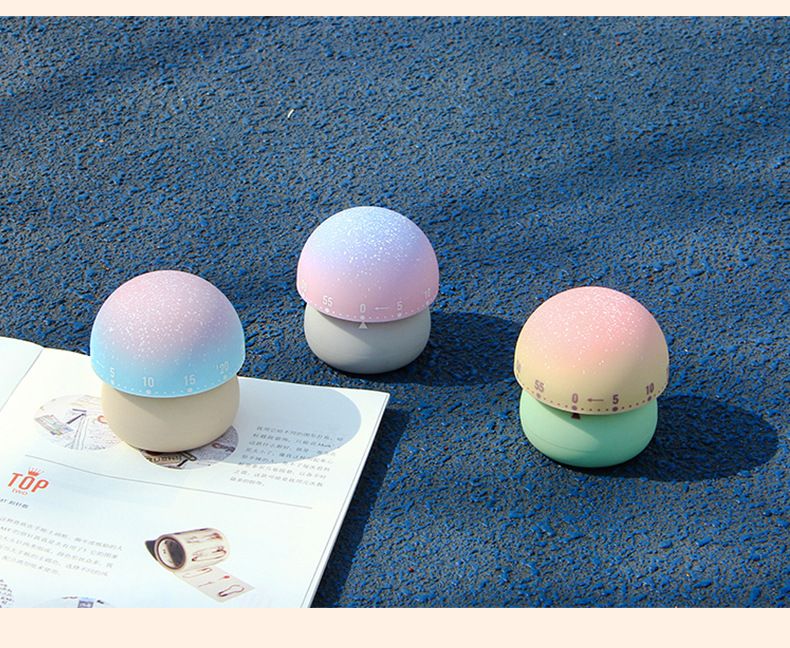 Set of three mechanical mushroom kitchen timers for kids, wind-up countdown timers for classroom and home pretend play.