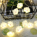 Cute cloud-shaped room lamp with face, warm white glow, perfect for kids' bedroom decor and holiday string lighting.