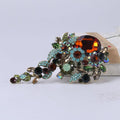 Fashion brooch pin featuring a fish drip oil design with crystal glass accents, suitable for women's shirts and floral outfits.