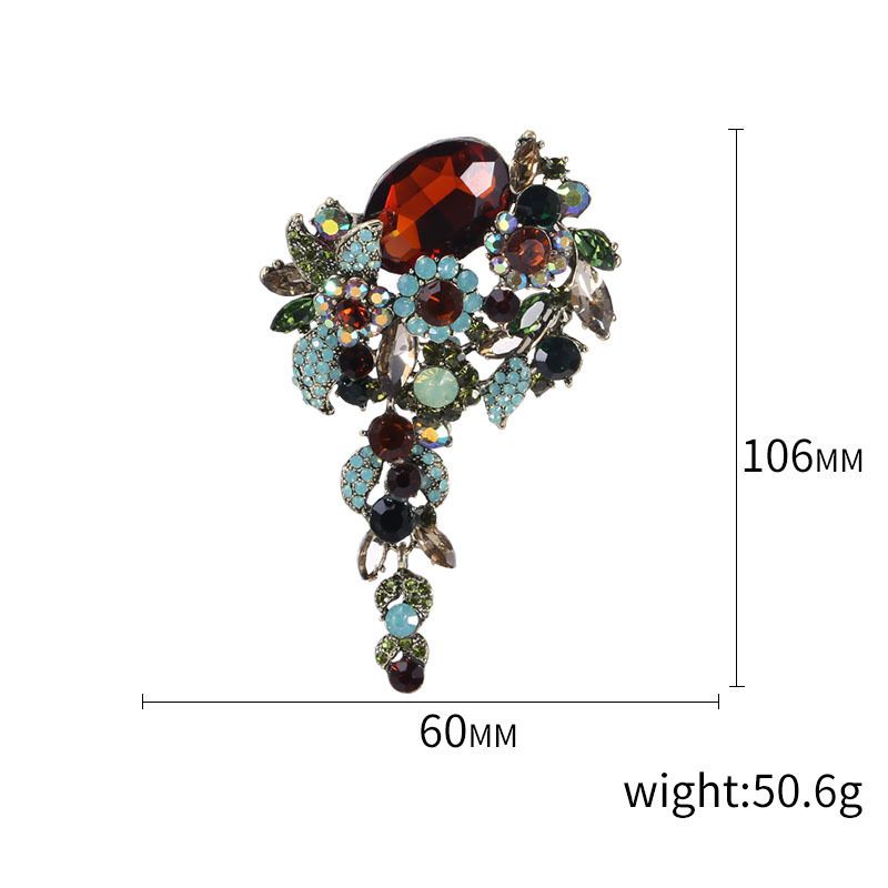Fashion brooch pin with fish drip oil design and crystal accents, suitable for women's shirts and floral accessories.