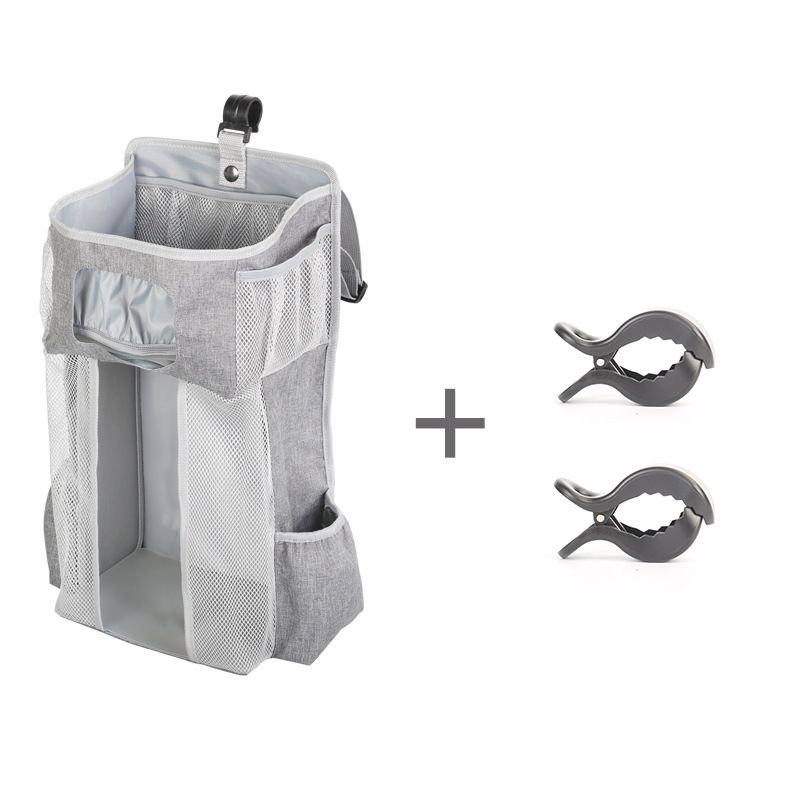 Everything Baby hanging diaper organizer with multiple compartments for baby diapers and essentials on a nursery changing table