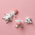 Three cute cow butt resin refrigerator magnets with playful design, suitable for decorating and sticking on metal surfaces.