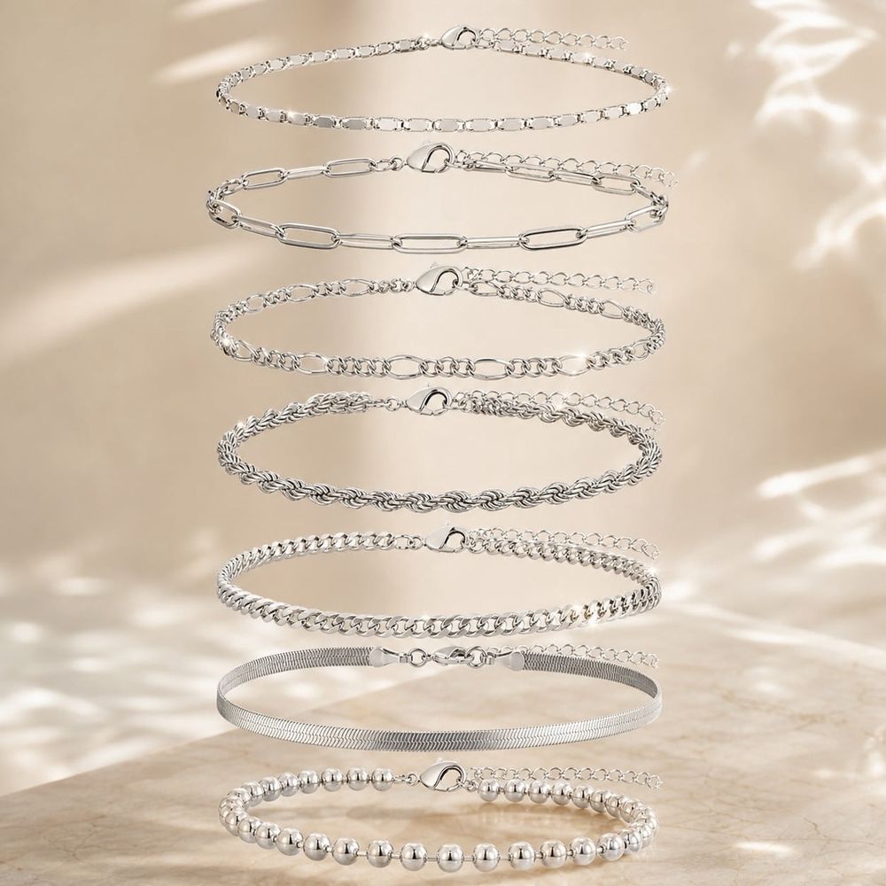 Seven-piece waterproof ankle bracelet set for women featuring S925 sterling silver, layered Cuban chain and herringbone designs.
