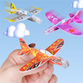 Set of 60 mini foam glider planes with colorful designs, lightweight and easy to assemble flying toys for kids' classroom prize boxes.