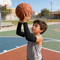 Four pairs of black and white kids' arm sleeves from Everything Baby, reusable sun protection and cooling compression for boys and girls.