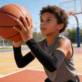Four pairs of black and white kids' arm sleeves by Everything Baby, reusable sun protection and cooling compression for boys and girls.
