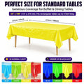 Three colorful disposable fluorescent neon plastic table cloths for glow-in-the-dark party, waterproof rectangular covers for kids' events