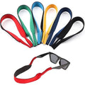 Seven-pack of anti-slip silicone glasses straps in black, red, brown, gray, blue, green, and yellow for kids and adults.