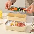 Stainless steel double layer lunch box by Everything Baby, microwave-safe bento with multiple compartments for kids' meals.