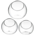 Three clear glass terrarium bowls with beveled openings, ideal for home decor or storage in pretend play setups.