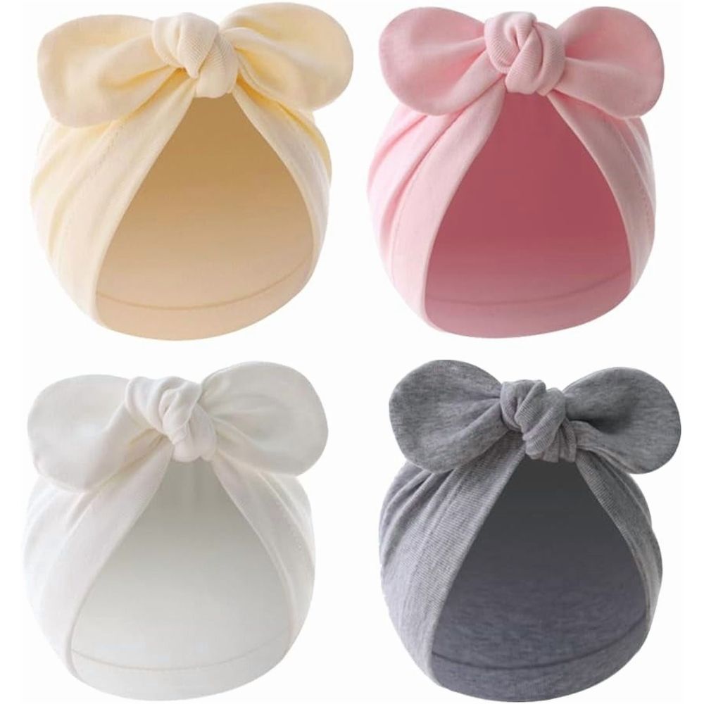 Four baby girl cotton hats with knotted rabbit ears for infants aged 0-12 months, soft and adorable for young children.