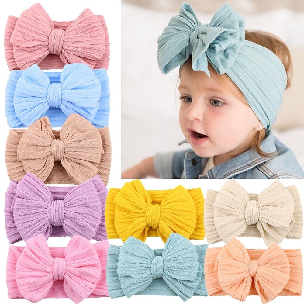 Three soft handmade nylon baby girl headbands with bows, toddler hair accessories for newborns and kids, by Everything Baby.