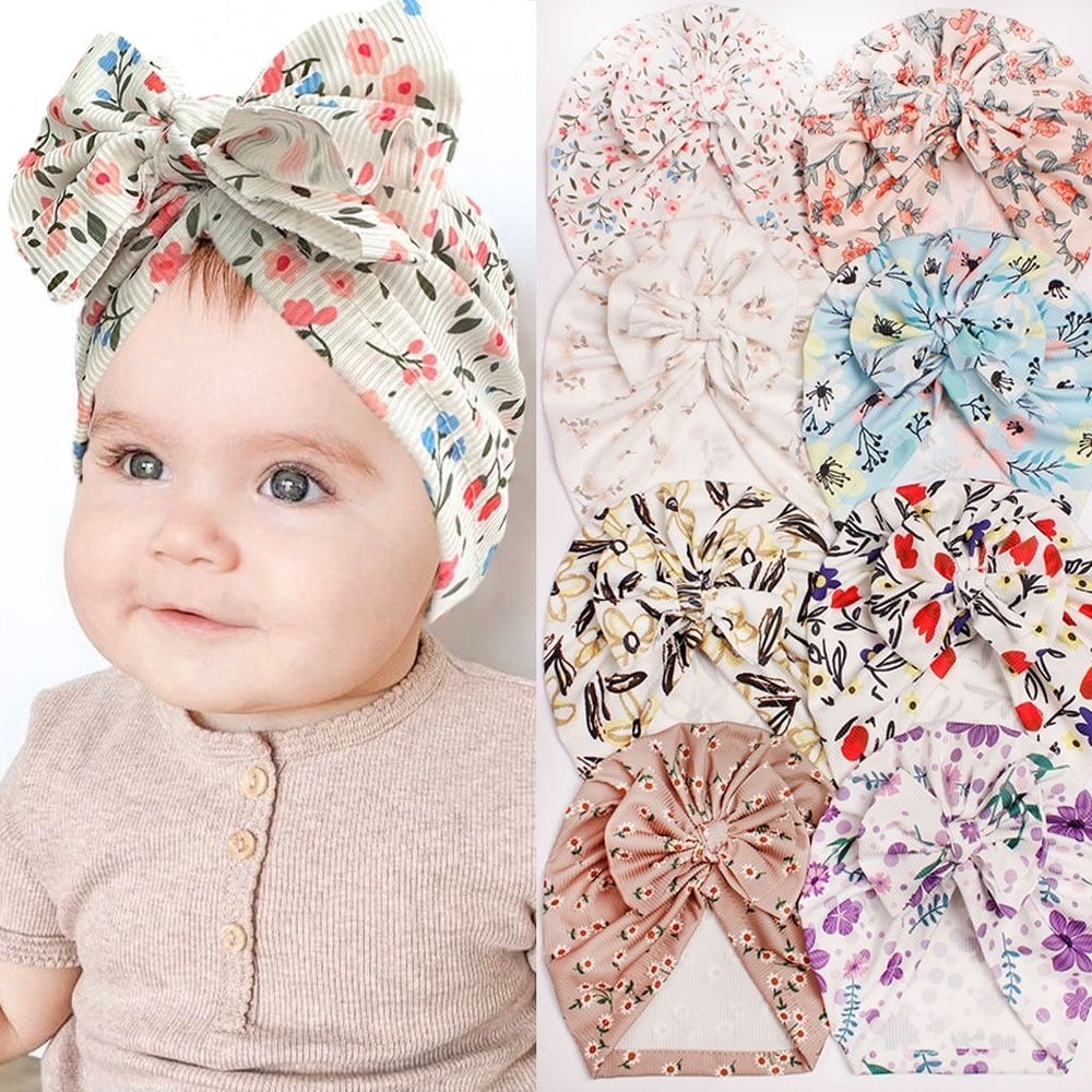 Newborn baby girl hat with a bow, pink toddler beanie cap for infants 0-24 months, from Everything Baby, soft and cozy for hospital or everyday wear.