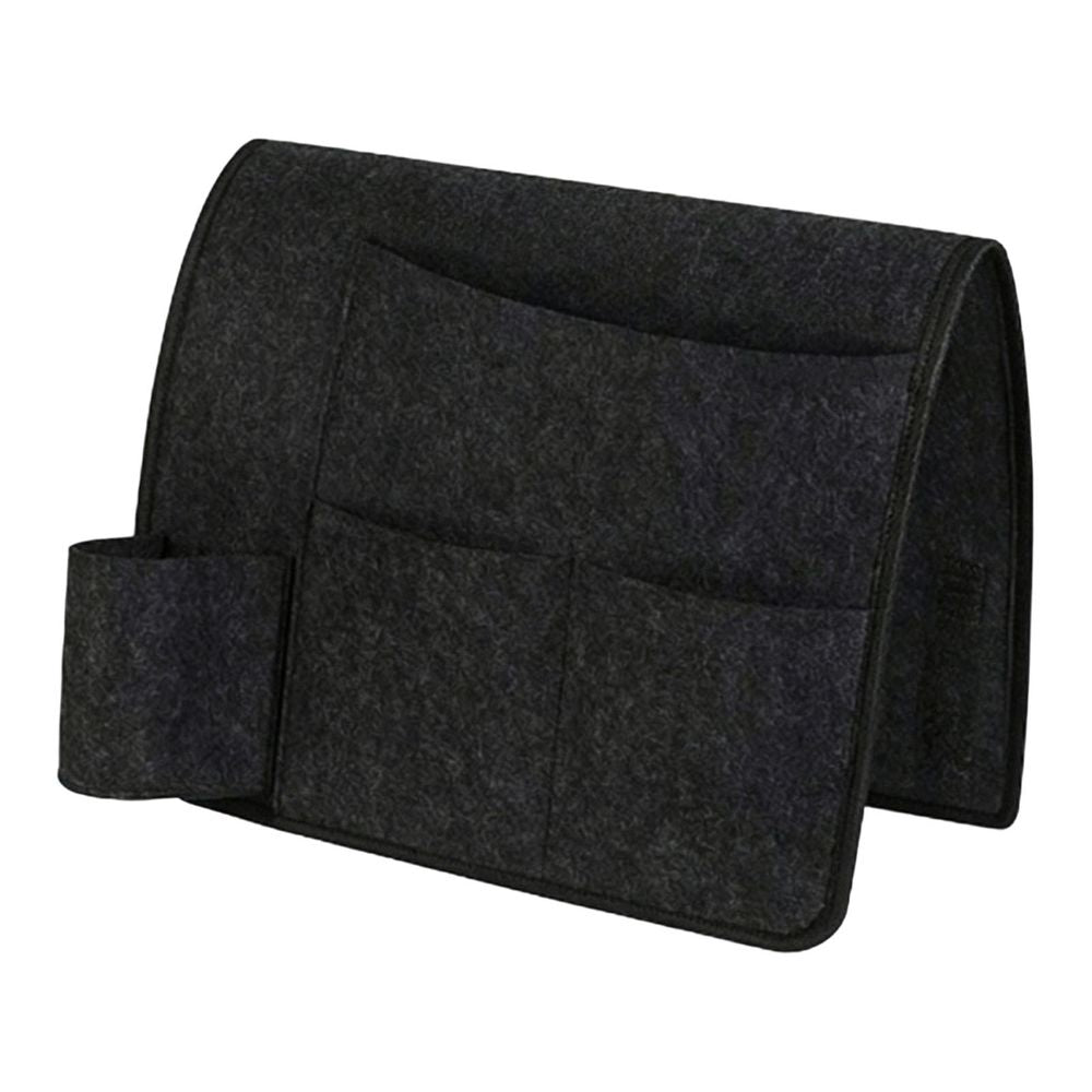 Dark gray bedside caddy organizer with four pockets hanging on a bed for dorm or home, made of durable fabric for easy storage.