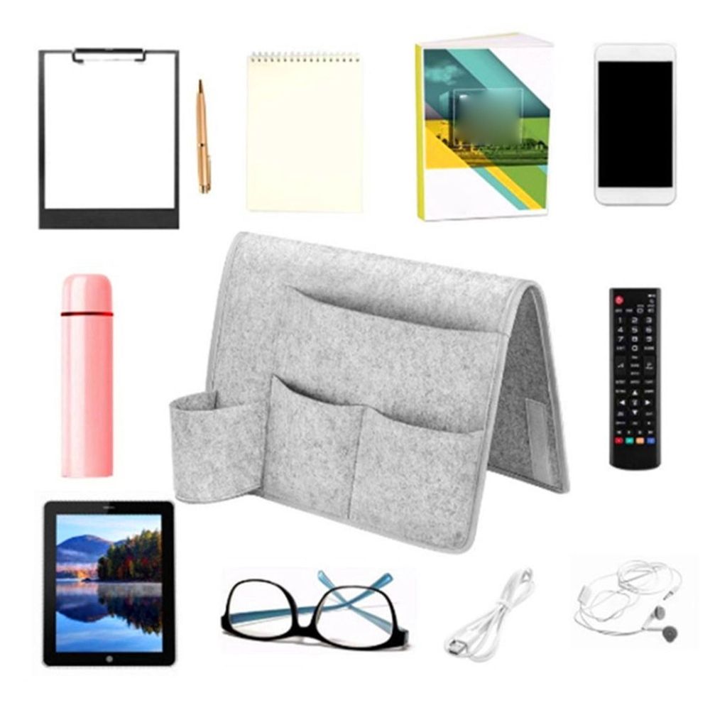 Dark gray bedside caddy organizer with four pockets hanging on bed or sofa, made of durable fabric, ideal for dorms and home use