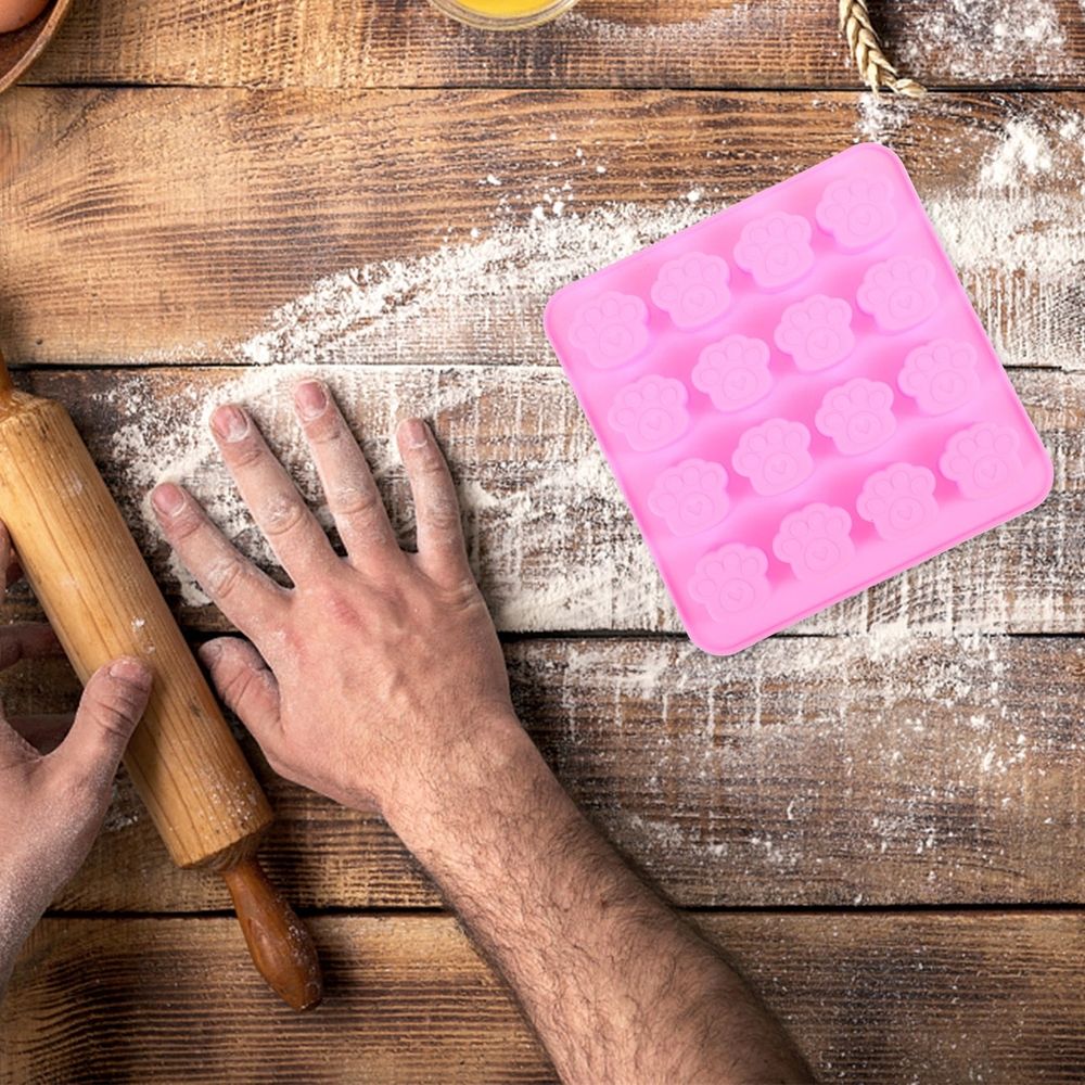 Two paw-shaped silicone molds for candy, chocolate, and dessert baking, ideal for home use, by Everything Baby.