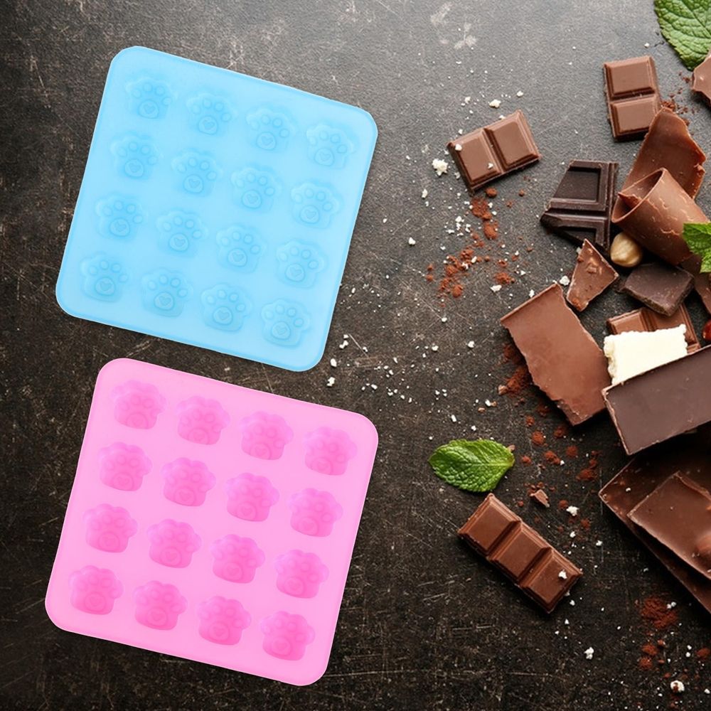 Two paw-shaped silicone molds for candy, chocolate, and desserts, perfect for baking and home use from Everything Baby.
