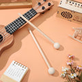 Pair of wooden xylophone mallets for kids, designed for early music education and kindergarten musical activities.