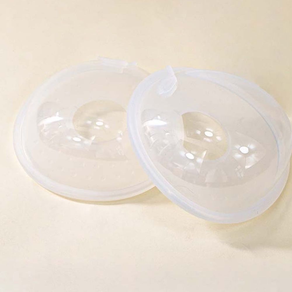 Two leakproof silicone breastfeeding collector shells from Everything Baby, designed for comfortable, convenient use by nursing moms.