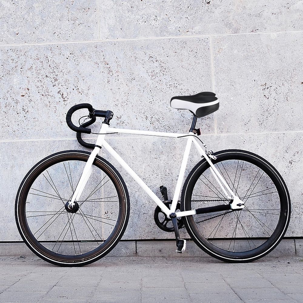 White thick gel mountain bike saddle with central airflow and reflective back for kids' bikes by Everything Baby.