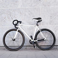 White thick gel mountain bike saddle with central airflow and reflective back for kids' bikes by Everything Baby.