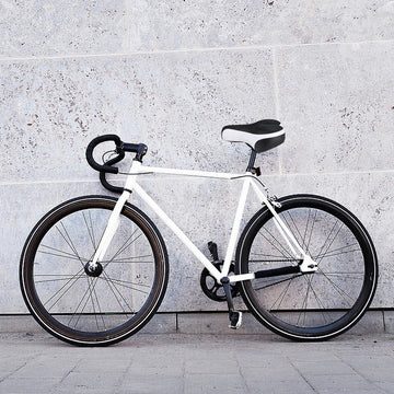 White thick gel mountain bike saddle with central airflow and reflective back for kids' bikes by Everything Baby.