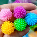 Set of 15 colorful small massage balls with hedgehog design for baby and kids, ideal for foot and body relaxation and play.