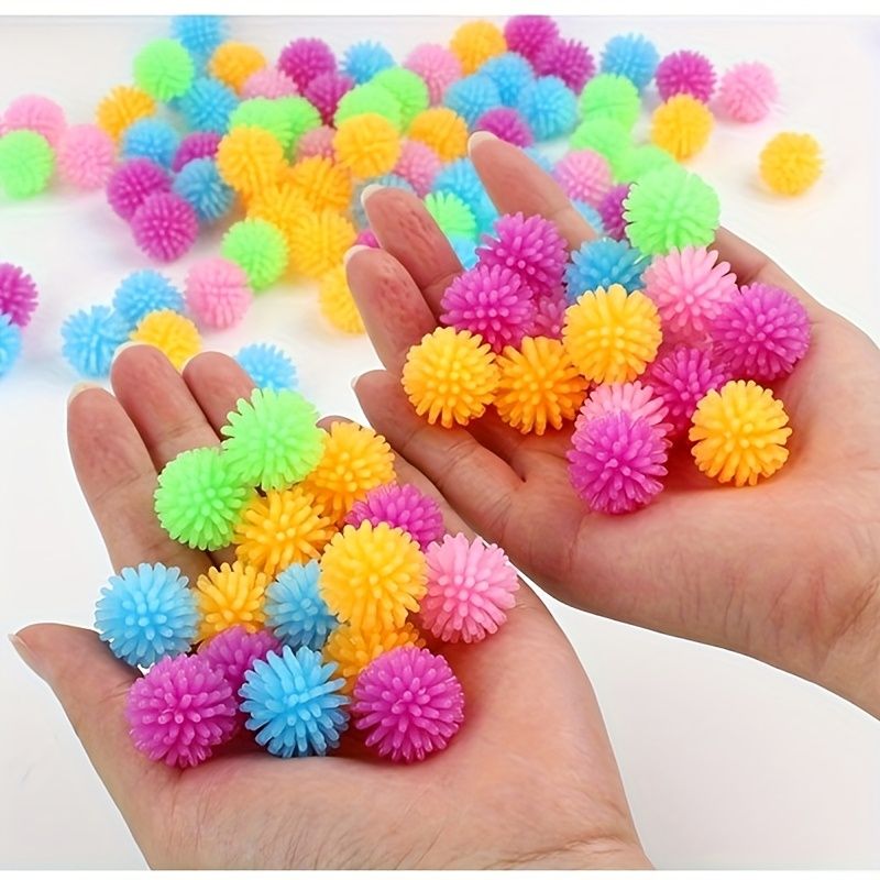 Set of 15 colorful small massage balls with hedgehog design for kids, ideal for foot and body relaxation, in random colors.