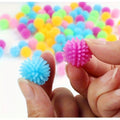 Set of 15 colorful baby massage balls with hedgehog design, ideal for foot and body relaxation and play in a ball pit.