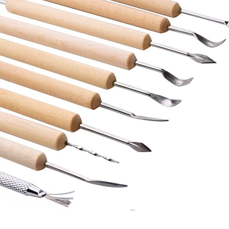 Set of 11 pottery clay sculpting tools with double-sided tips and wooden handles for trimming and embossing ceramics projects.