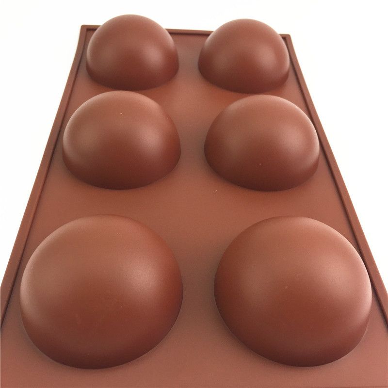 Silicone hot chocolate cocoa bomb mold with 6 large semi-spherical cavities, ideal for DIY holiday and Valentine's treats.