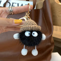 Fluffy woolen plush keychain with soft ball design, ideal for bags and backpacks, by Everything Baby, featuring cute, colorful weaving.