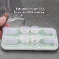 Silicone Labrador-shaped ice cube mold from Everything Baby, showing four cute dog-shaped ice balls for drinks.