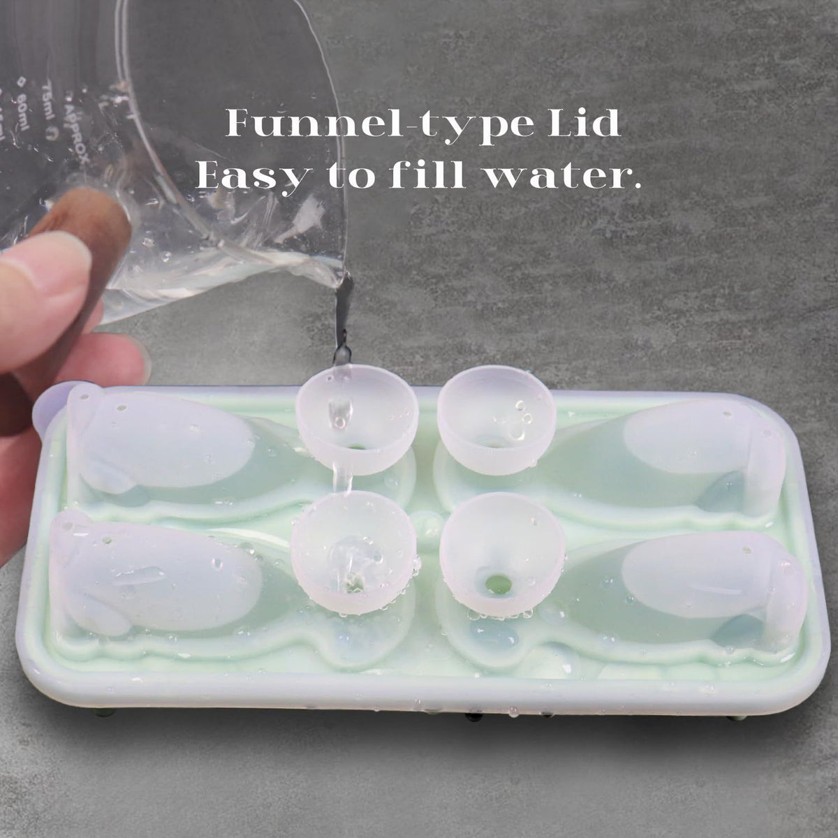 Silicone Labrador-shaped ice cube mold from Everything Baby, showing four cute dog-shaped ice balls for drinks.