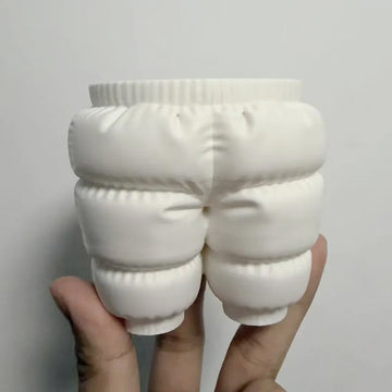 A unique 3D printed down-filled pants pen holder desktop organizer, white.