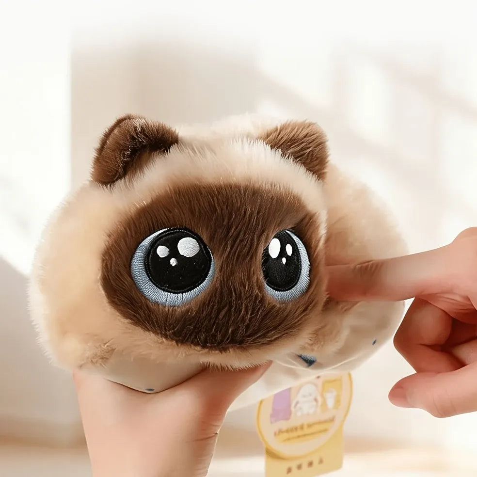 Soft, fluffy Siamese cat plush toy with big eyes, perfect for cuddles and playtime, from Everything Baby.