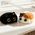 Soft, fluffy calico cat plush toy with big eyes, perfect for cuddling and play for babies and kids.