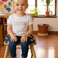 Blue unicorn print toddler booster seat cushion with adjustable safety straps and washable polyester cover, 8 cm thick, 32x32 cm.