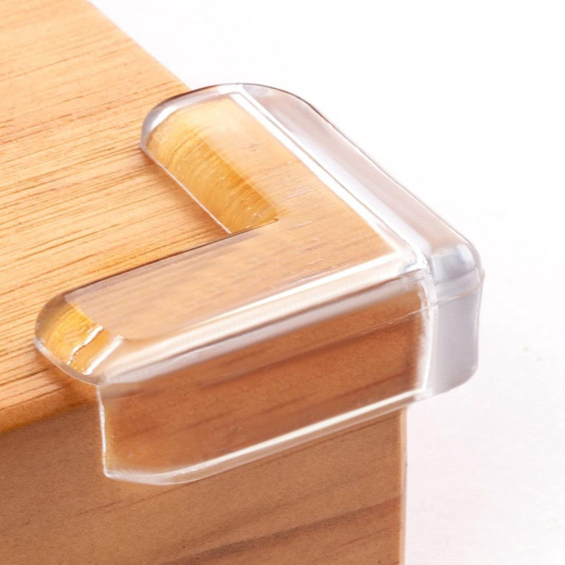 Eight clear baby corner protectors from Everything Baby, adhesive L-shaped guards for nursery furniture safety, transparent and child-friendly.