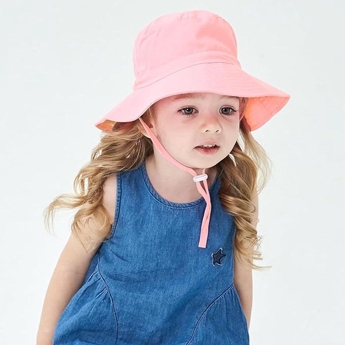 Pink baby sun hat with wide brim, breathable cotton, foldable bucket style for infants, outdoor beach travel, size 44-46 cm.