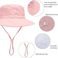 Pink baby sun hat with wide brim, breathable cotton foldable bucket hat for infants, outdoor beach travel, size XS 44-46 cm.