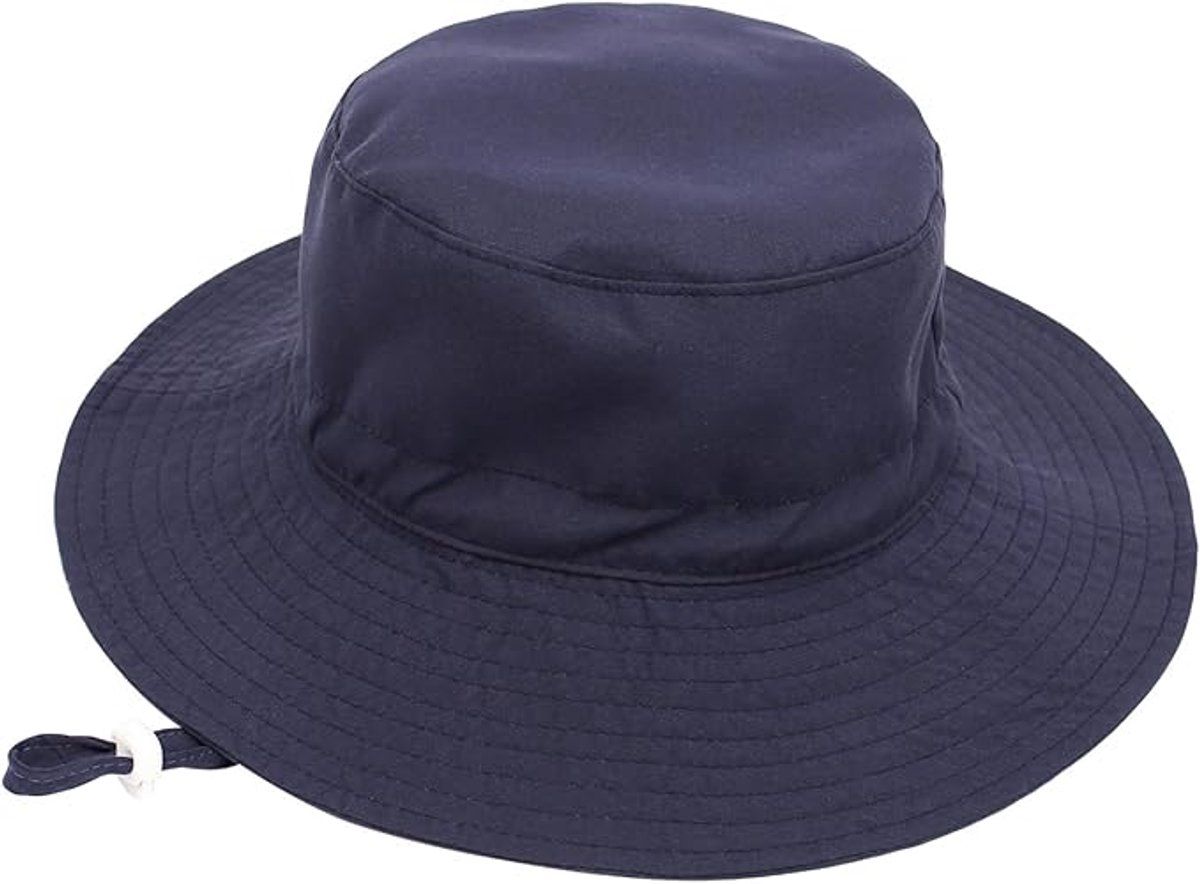 Baby boy wearing dark blue cotton baby sun hat with wide brim, foldable bucket style for outdoor and beach protection.