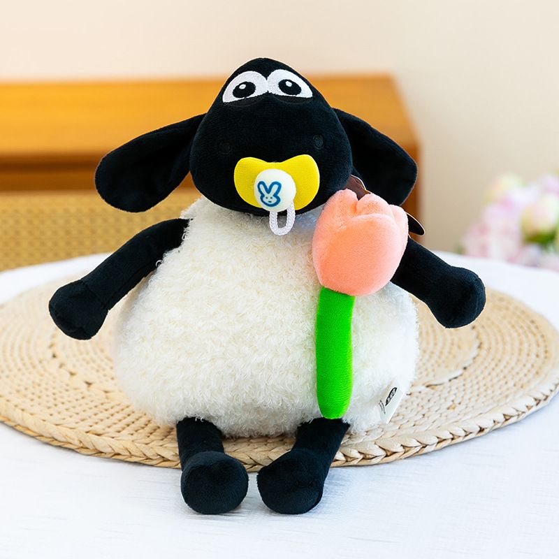 Cute Shaun the Sheep plush toy with a tulip, soft stuffed animal for kids, 30cm, perfect as a birthday gift.