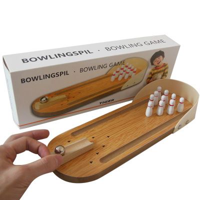 Colorful tabletop bowling game for kids by Everything Baby, featuring small pins and a ball for fun indoor activity.