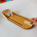 Baby and kids tabletop bowling game by Everything Baby, featuring colorful miniature pins and a small ball for indoor play.