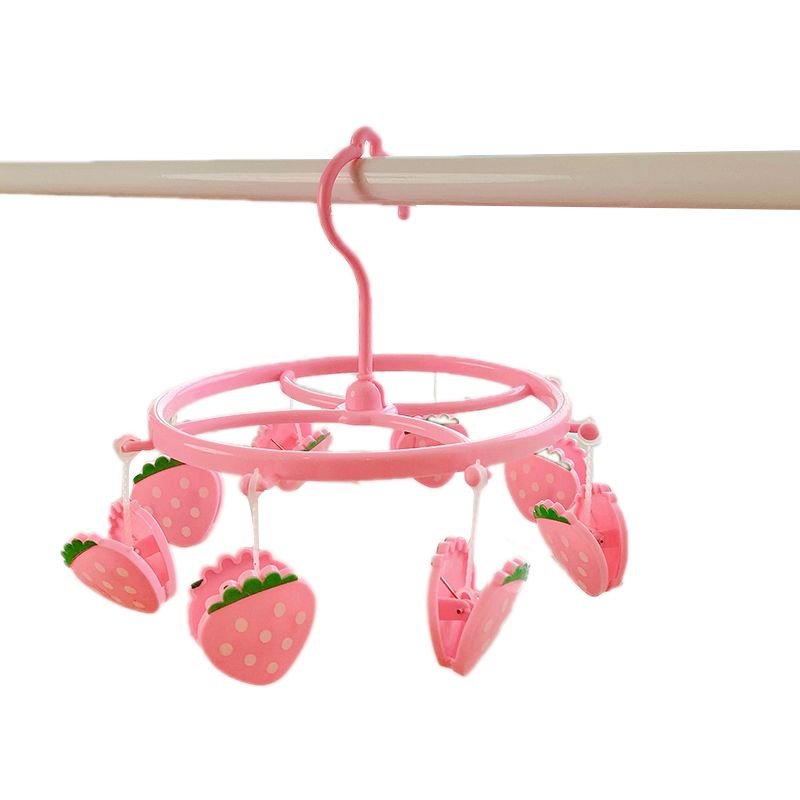 Pink strawberry plastic hanging drying rack for socks and underwear, small cloth clips, suitable for home or dormitory use.