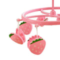 Pink plastic hanging drying rack with small cloth clips for socks and underwear, designed for kids' sleepwear storage.