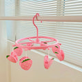 Pink plastic hanging drying rack with small cloth clips, designed for socks and underwear, ideal for home or dormitory use.