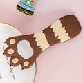 Colorful silicone cat paw bottle opener with fridge magnet, vibrant stripes, and playful design, perfect for kitchen use.
